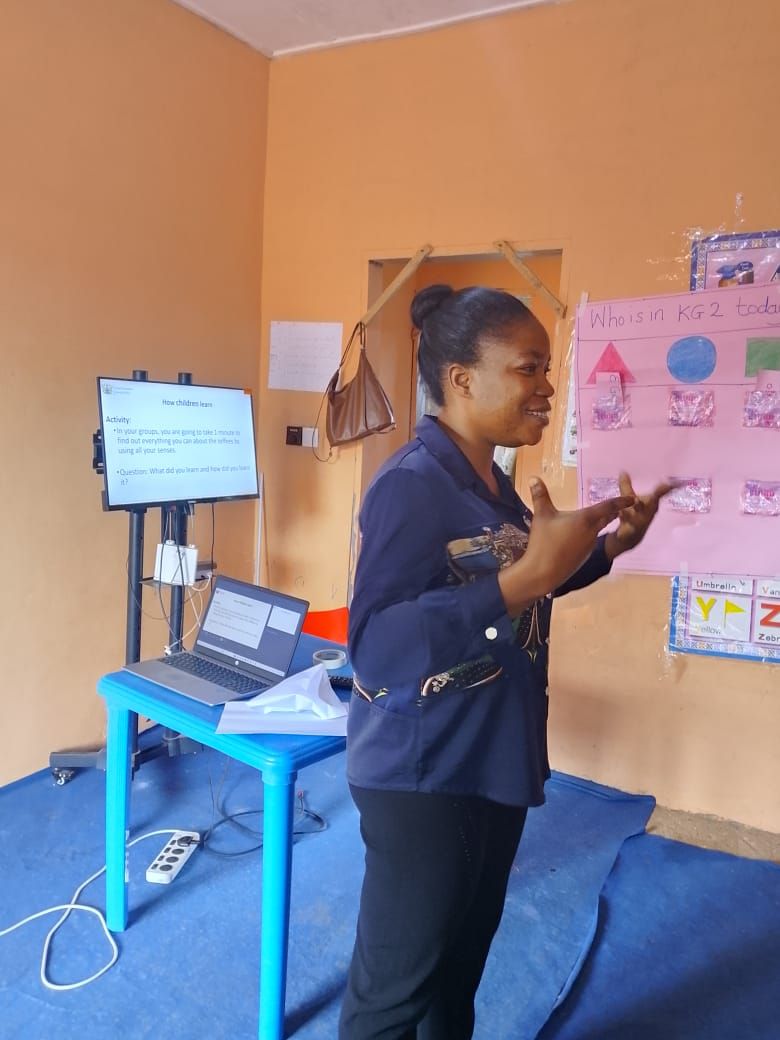 Madam Georgina Nanewortor leading a session on how children learn
